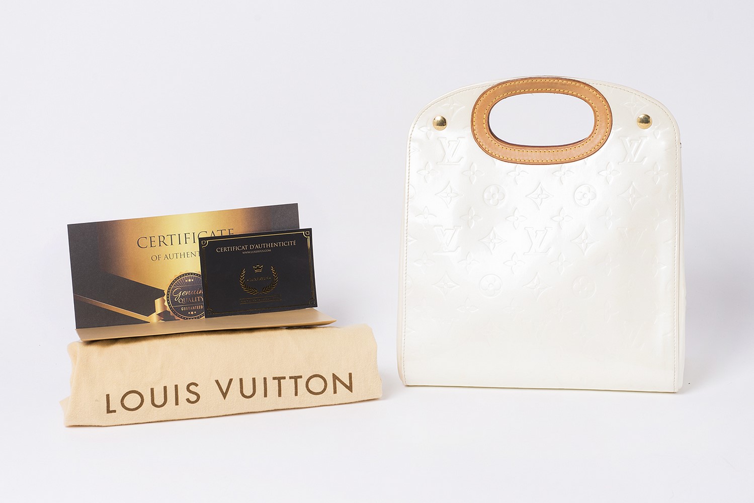 Sac Louis Vuitton Authentique d'occasion en cuir vernis monogram empreint couleur crème