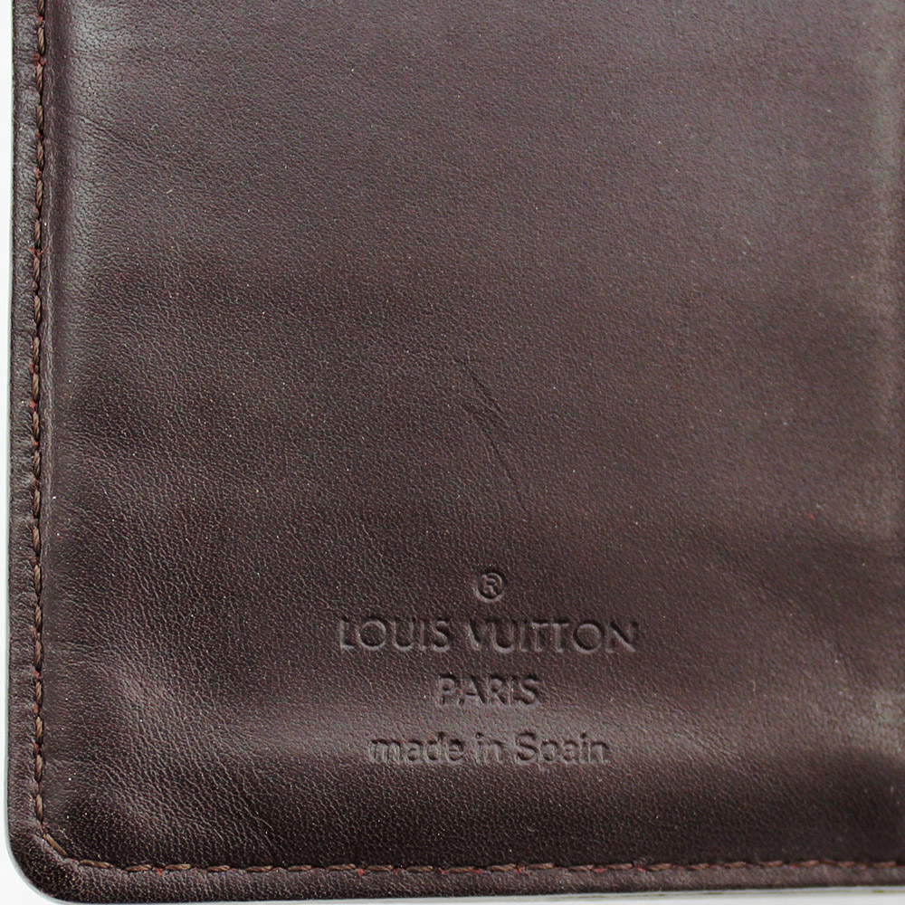 Porte-agenda Louis Vuitton monogram empreinte Authentique d'occasion en cuir vernis couleur amarante (mauve)
